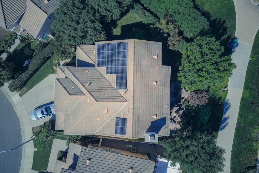 Overhead image of house with solar panel systems.