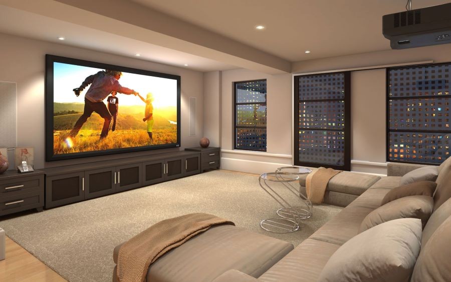 A casual home theater with a projector, Screen Innovations movie screen, and tan couch.