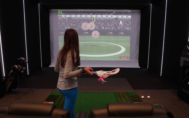 Lacrosse simulator setup showcasing realistic gameplay with immersive graphics, part of the sports simulators and theaters solutions by ResTech Systems.