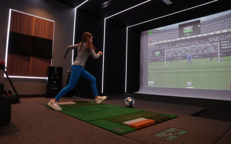 Soccer simulator setup showcasing realistic gameplay with immersive graphics, part of the sports simulators and theaters solutions by ResTech Systems.