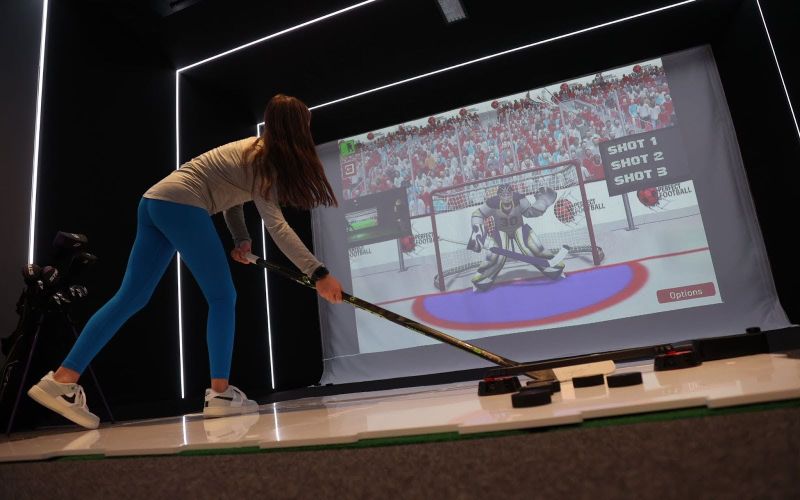 Hockey simulator featuring an interactive experience with lifelike graphics and gameplay, part of the Experience Center solutions by ResTech Systems