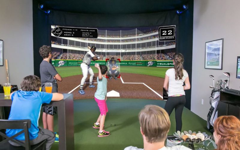 Baseball simulator setup showcasing realistic gameplay with immersive graphics, part of the sports simulators and theaters solutions by ResTech Systems.